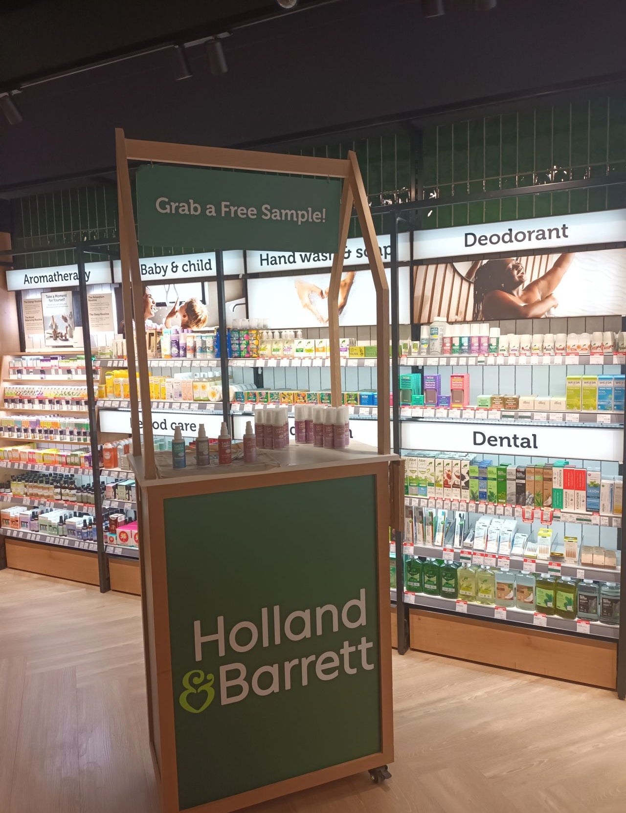 Holland & Barrett's new Cardiff Experience Store featuring a free sample stand near the deodorant section where Salt of the Earth natural deodorants are displayed
