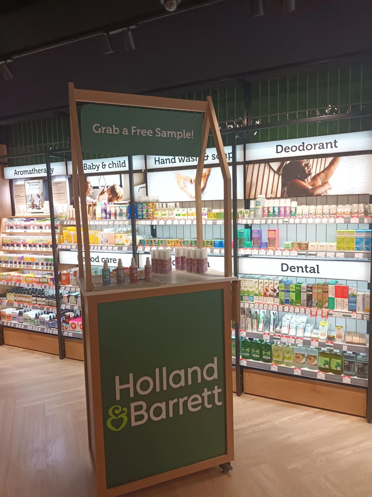 Holland & Barrett's new Cardiff Experience Store featuring a free sample stand near the deodorant section where Salt of the Earth natural deodorants are displayed